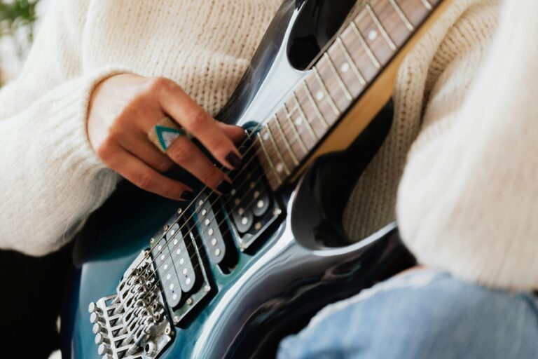 Person playing electric guitar