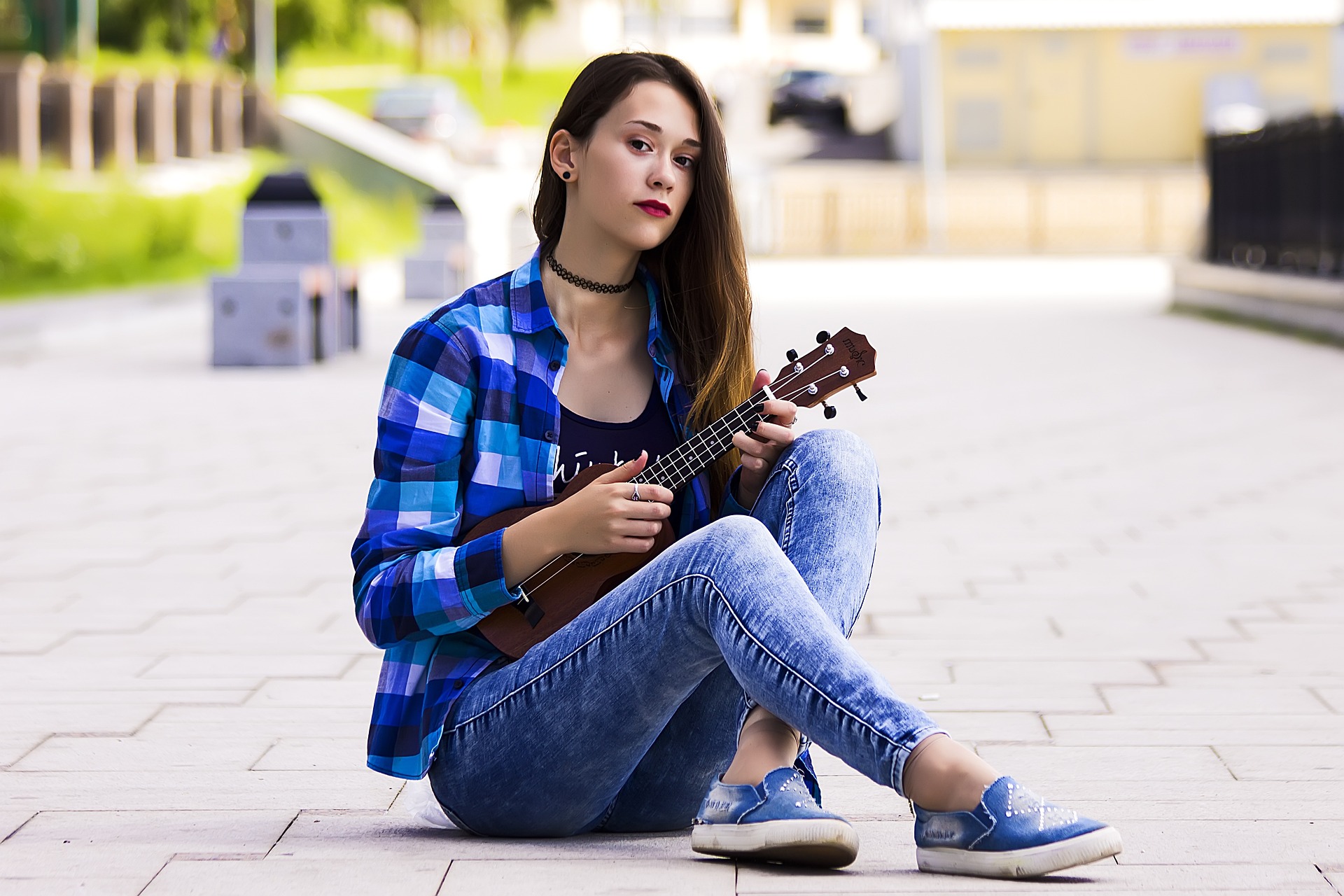 young woman playing ukulele